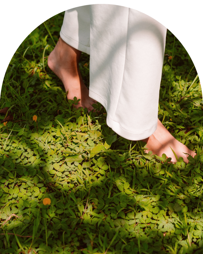 Image of woman walking through moss in barefeet in the state of Oregon