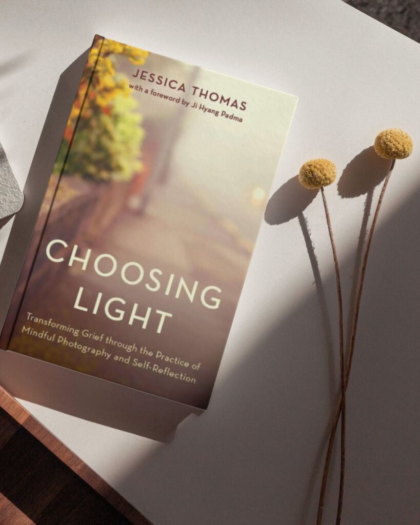 Image of Choosing Light book on the table, a book on therapy for grief and mindful photography